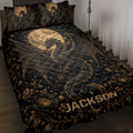Black and gold dragon quilt blanket displayed on a bed with moon, stars, wings, and floral artwork