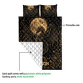 Dragon quilt blanket shown with a folded corner revealing the quilted backing and printed front
