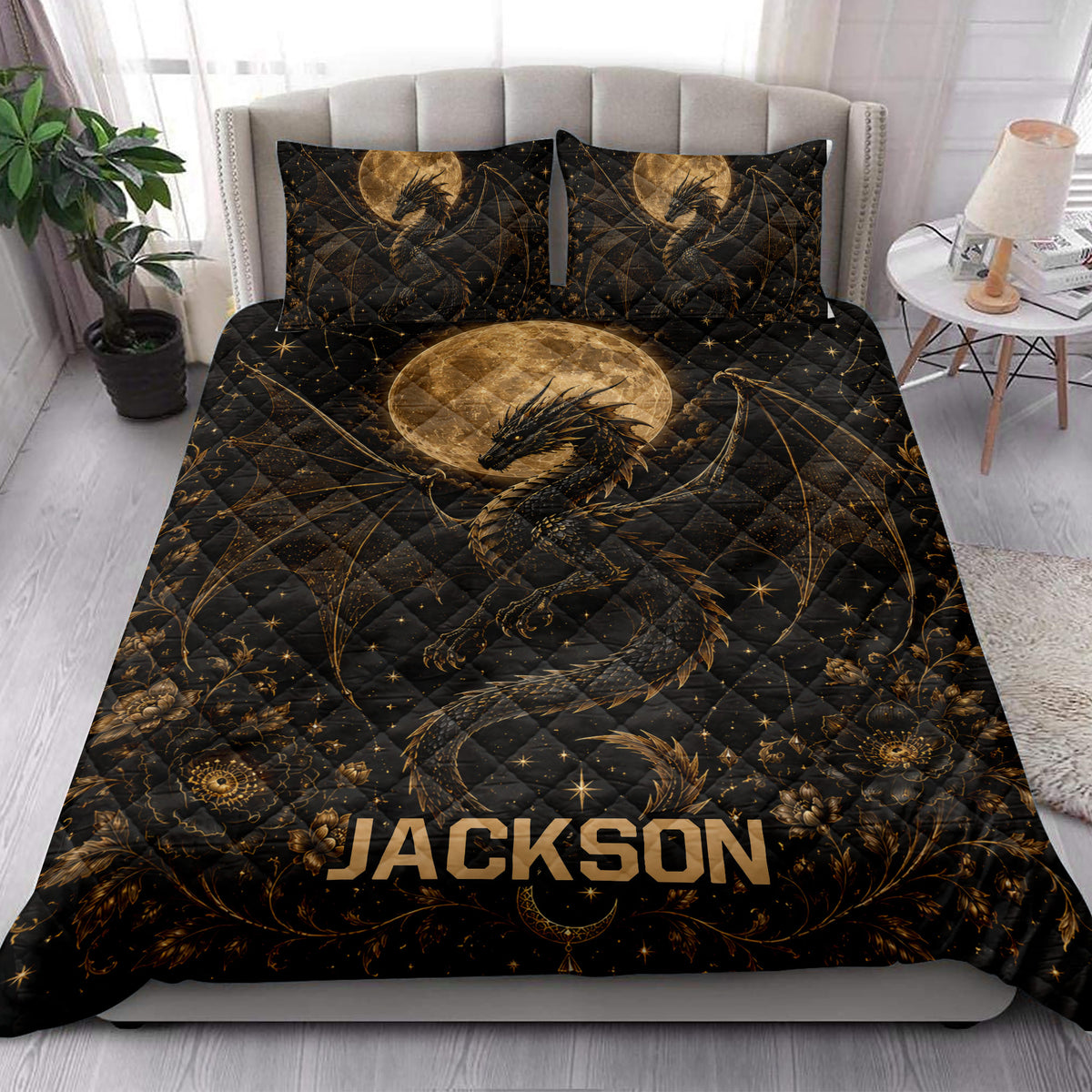 Gothic dragon quilt bedding styled in a bright bedroom with black, gold, moon, and floral details