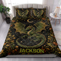 Dragon quilt blanket styled in a bright bedroom with green dragons, crescent moons, stars, and flowers