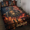 Firefighter quilt blanket displayed on a bed with fire scenes, fire truck artwork, and an American flag background