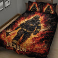Close bedroom view of a firefighter quilt blanket featuring a dramatic firefighter surrounded by flames