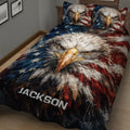 Close bedroom view of an eagle quilt with bold stars and red, white, and blue artwork