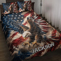Eagle quilt blanket displayed on a bed with patriotic red, white, and blue wing artwork