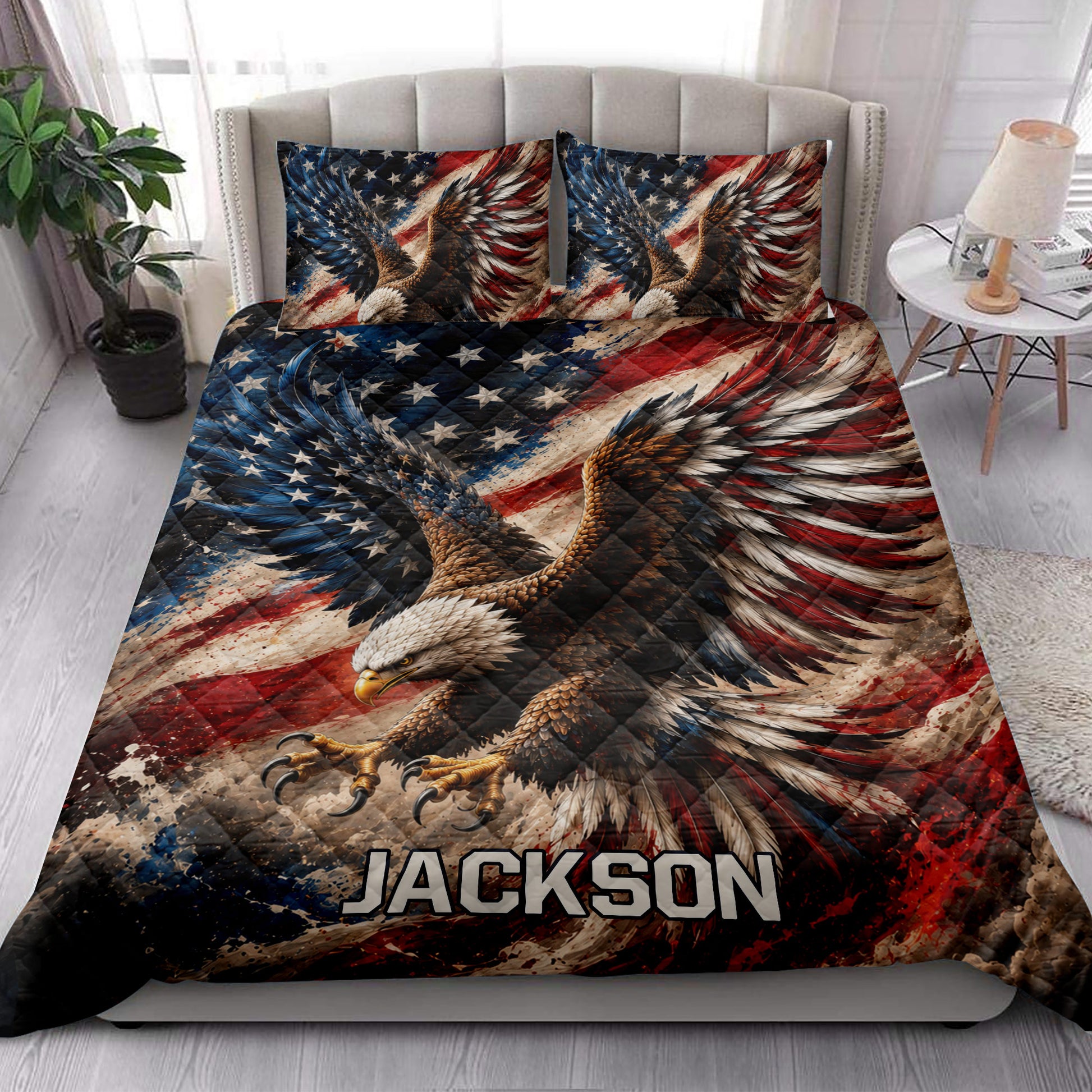Patriotic eagle quilt styled in a bright bedroom with bold red, white, and blue artwork
