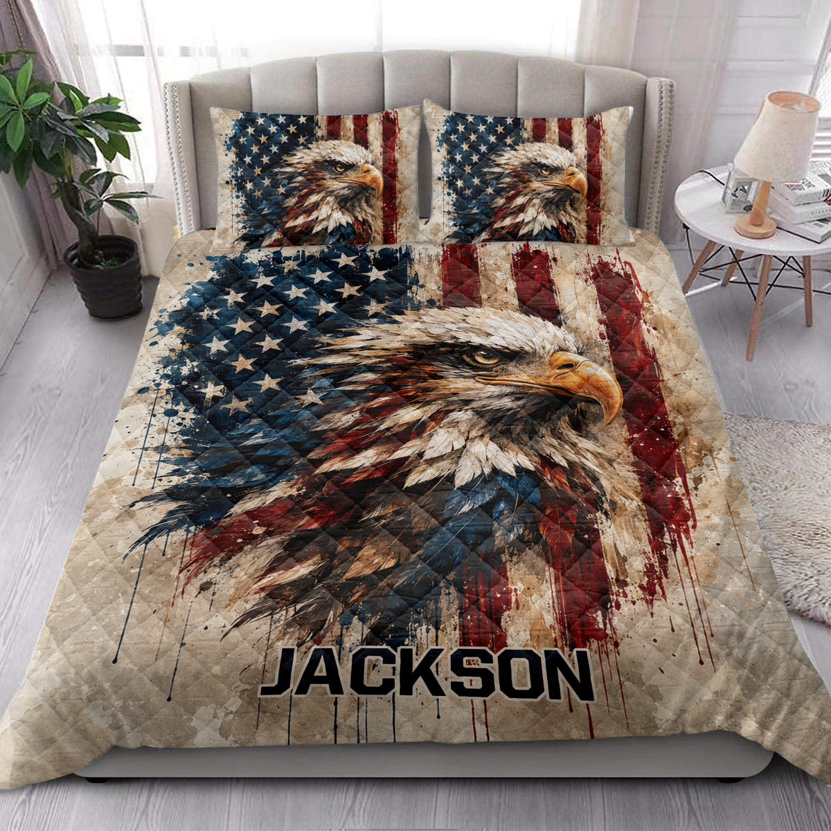 Patriotic eagle quilt blanket styled on a bedroom bed with coordinating eagle pillowcase designs