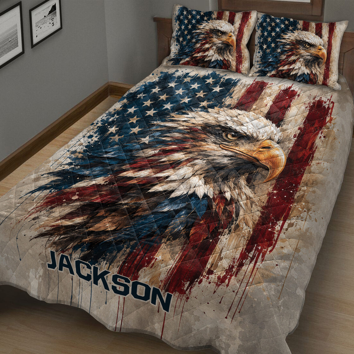 Close view of an eagle quilt blanket with bold stars, red stripes, and detailed feather artwork