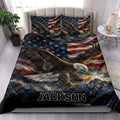 Eagle quilt bedding styled in a bright bedroom with bald eagle, mountain, and American flag artwork