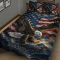 Close bedroom view of eagle quilt bedding featuring a large bald eagle flying over mountain scenery