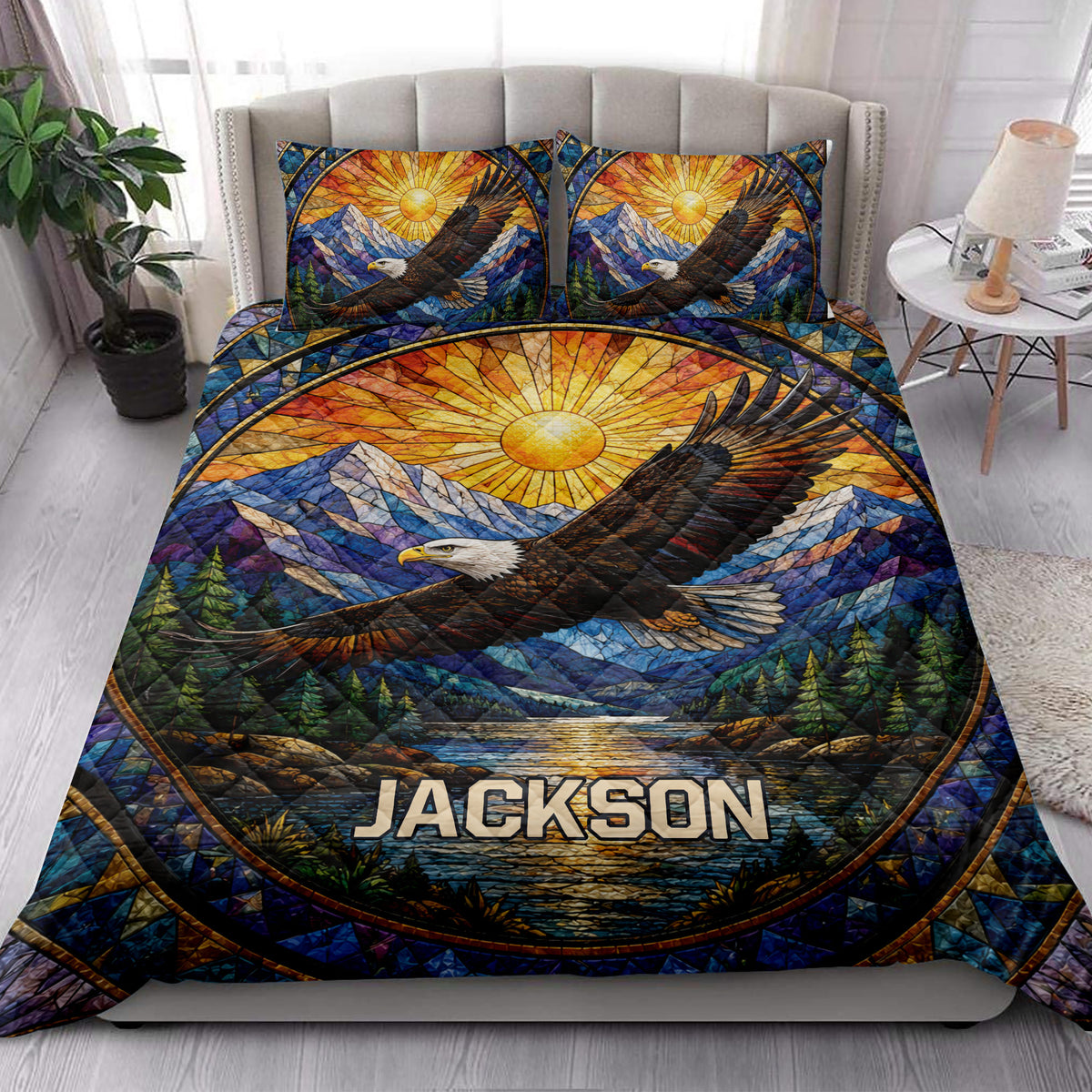 Eagle quilt bedding styled in a bright bedroom with mountain, forest, and sunrise scenery