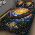 Close bedroom view of an eagle quilt blanket with colorful mountain and forest artwork