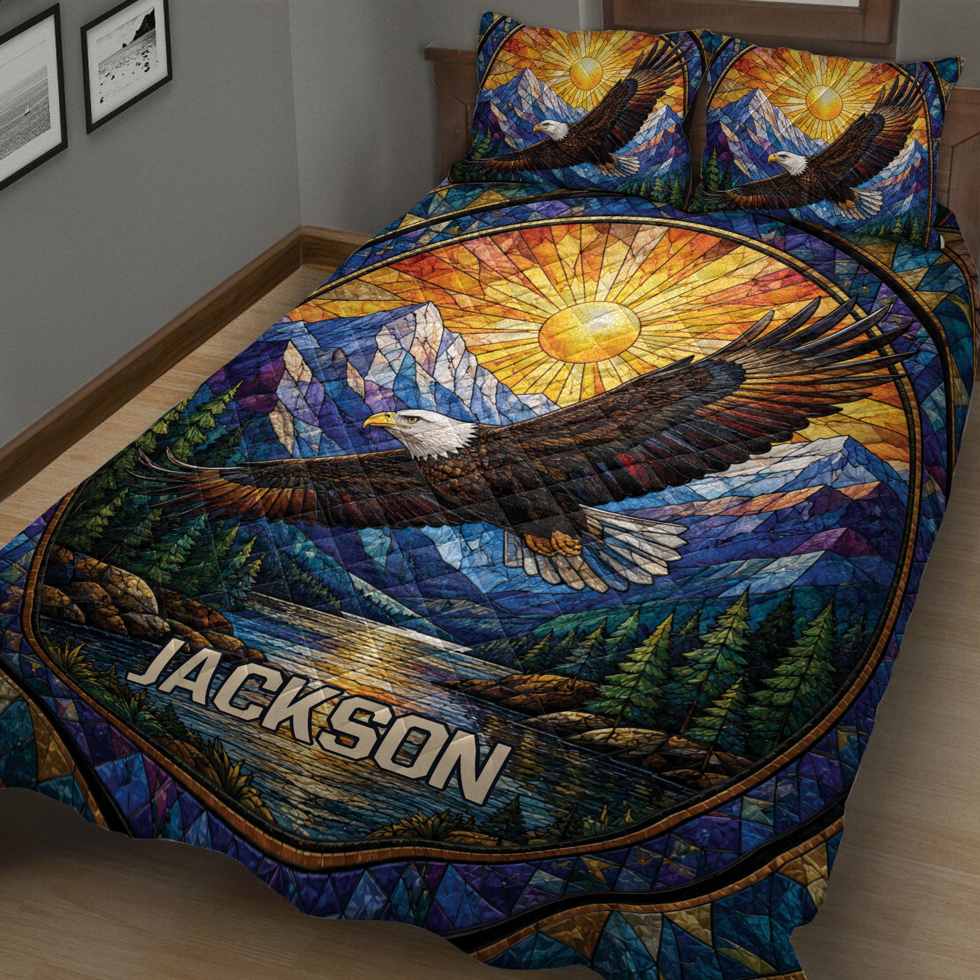 Close bedroom view of an eagle quilt blanket with colorful mountain and forest artwork