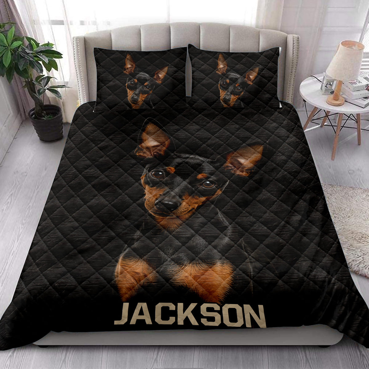 Miniature Pinscher quilt bedding styled on a bed in a bright contemporary bedroom