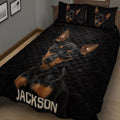 Close bedroom view of a black Miniature Pinscher quilt with matching dog portrait pillowcases