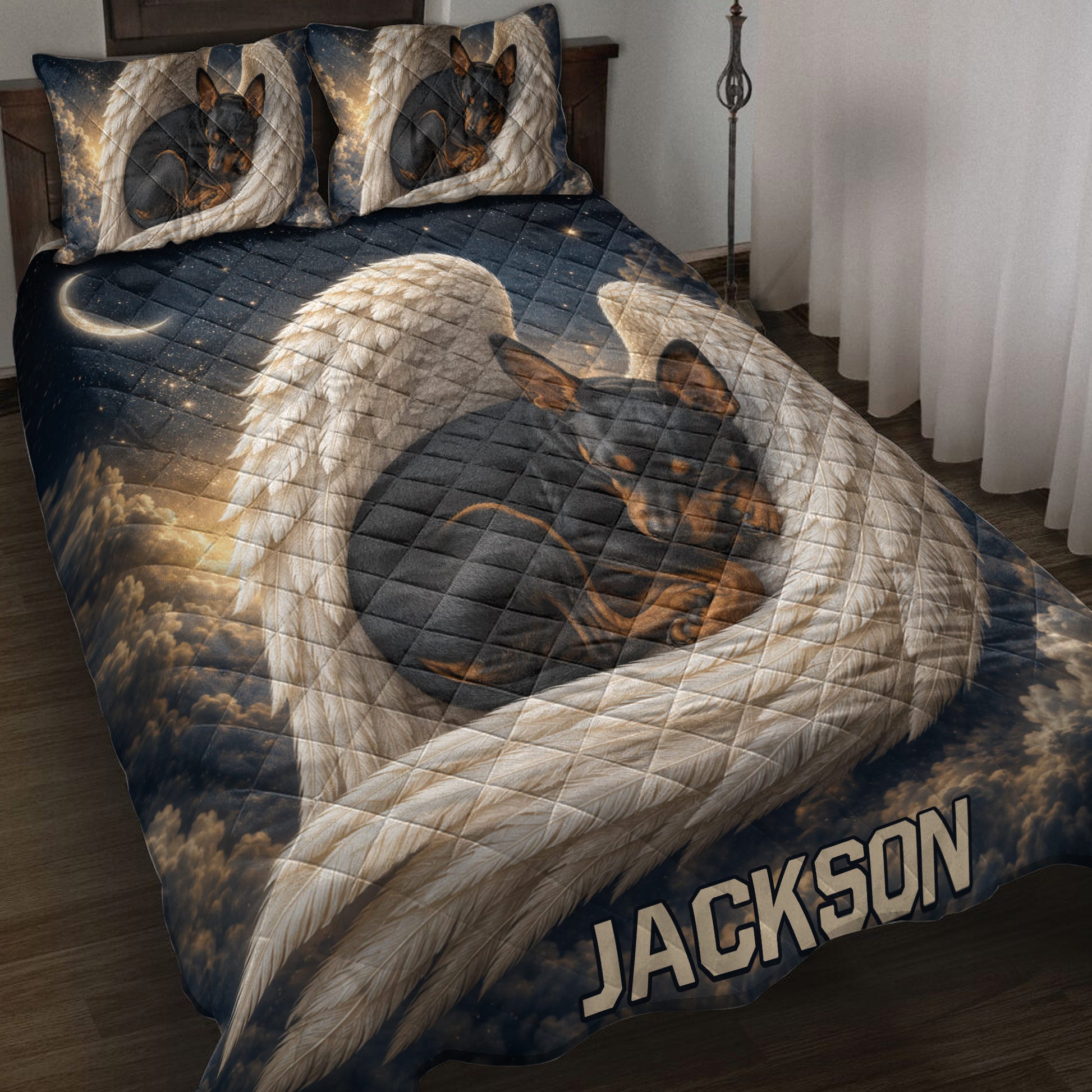 Miniature Pinscher quilt blanket on a bed with angel wings, stars, moon, and dark celestial artwork