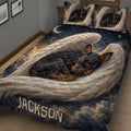 Close view of a Miniature Pinscher quilt blanket featuring sleeping dogs, angel wings, and a moonlit sky