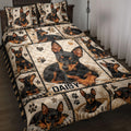 Miniature Pinscher quilt blanket displayed on a bed with portrait panels, paw prints, hearts, and stars