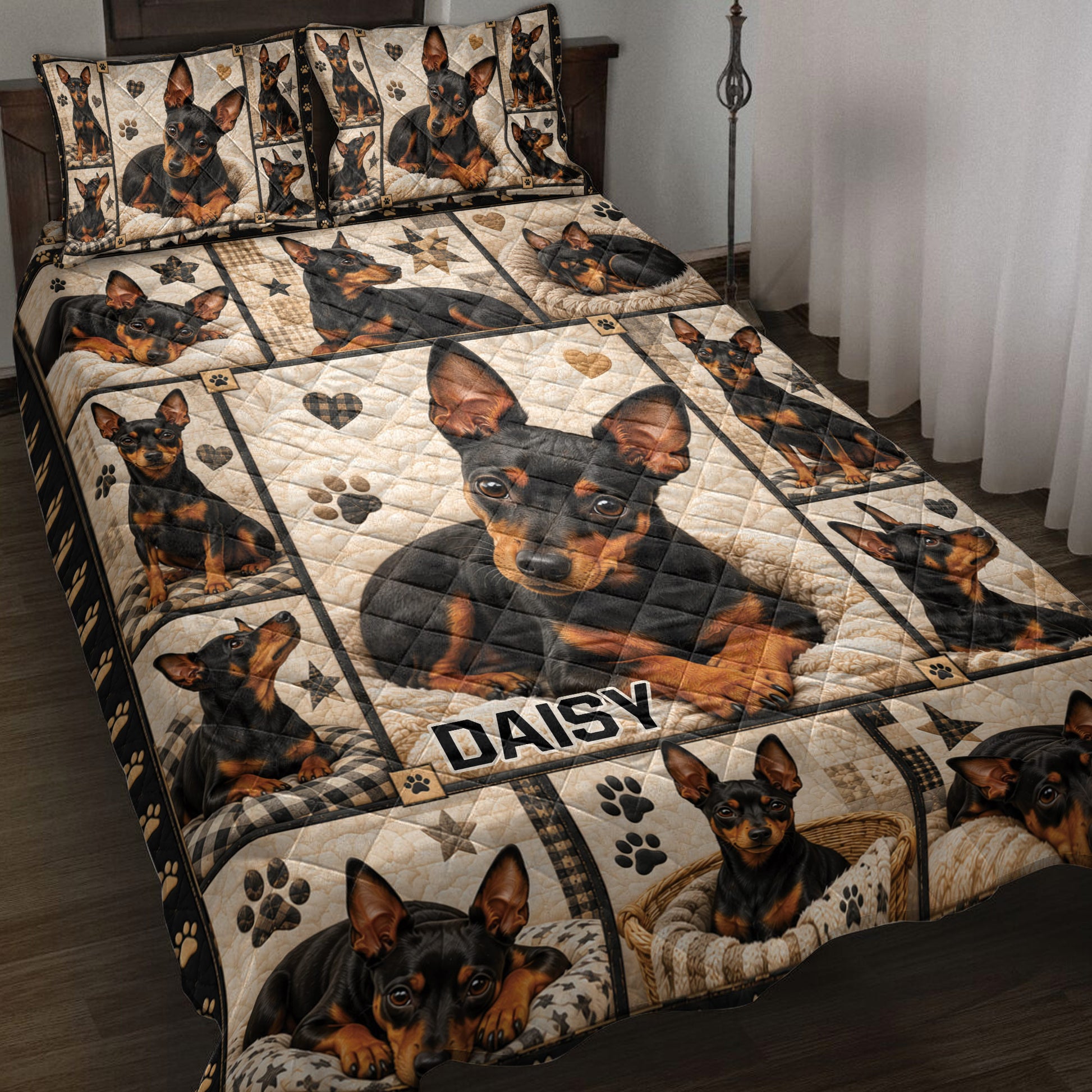 Miniature Pinscher quilt blanket displayed on a bed with portrait panels, paw prints, hearts, and stars