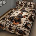Close bedroom view of a Miniature Pinscher quilt blanket featuring sleeping and standing dog portraits