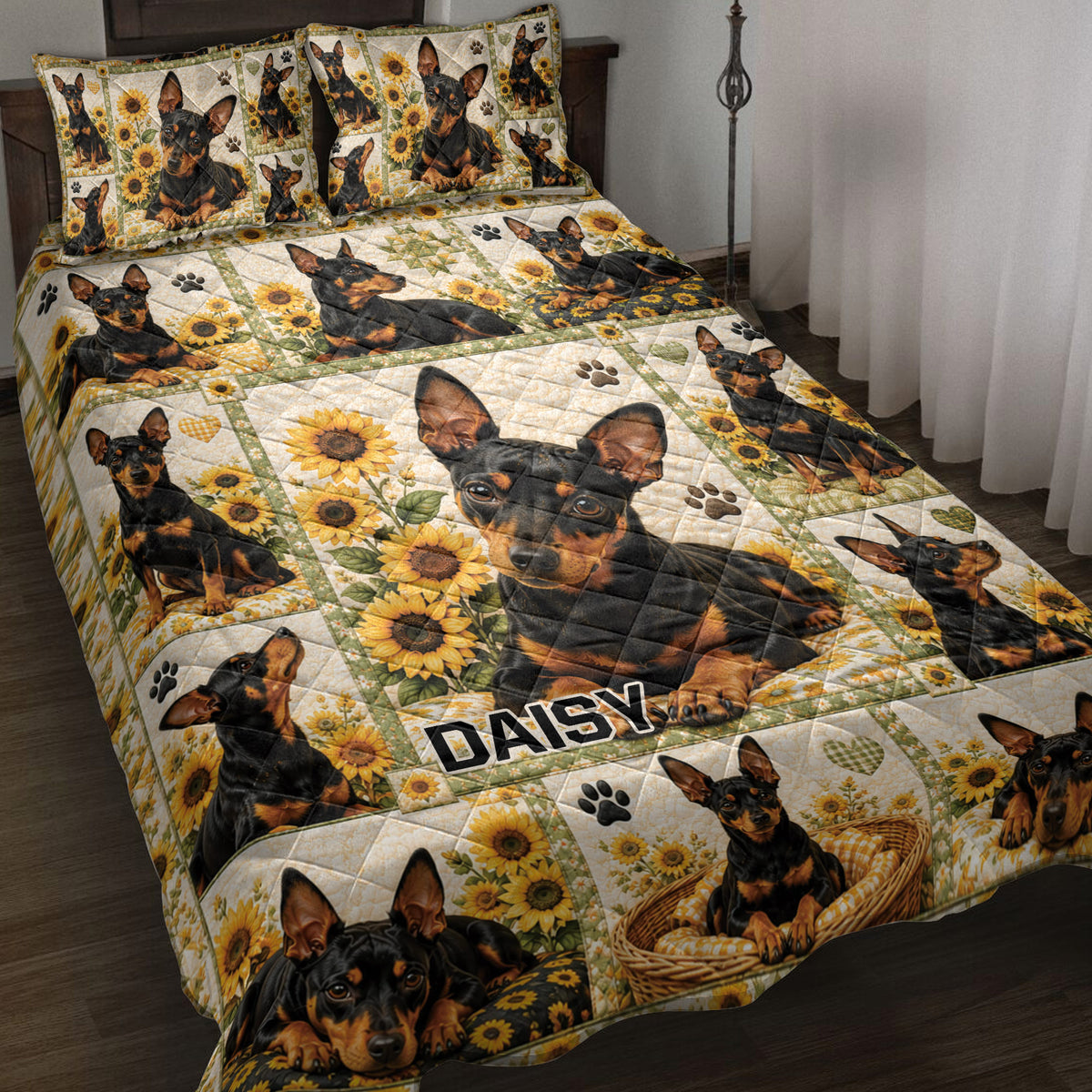 Miniature Pinscher quilt blanket displayed on a bed with sunflower panels, paw prints, and dog artwork