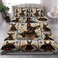 Miniature Pinscher quilt blanket styled on a bed with floral dog artwork, blue borders, and paw prints