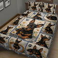 Miniature Pinscher quilt bedding displayed in a bedroom with repeated black and tan dog portraits