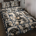Miniature Schnauzer quilt blanket displayed on a bed with navy patchwork, paw prints, and multiple dog portraits