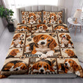 Beagle quilt blanket styled on a bedroom bed with repeated puppy portraits, paw prints, and warm brown patchwork