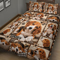 Beagle dog quilt blanket spread across a bed with playful puppy portraits, paw prints, and rustic geometric panels