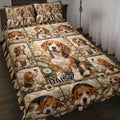 Beagle quilt blanket displayed on a bed with daisy panels, paw prints, and multiple playful dog portraits
