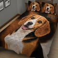 Close view of Beagle quilt blanket artwork with matching portrait pillows in a bedroom