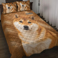 Shiba Inu quilt blanket bedding set displayed on a bed with matching dog portrait pillows