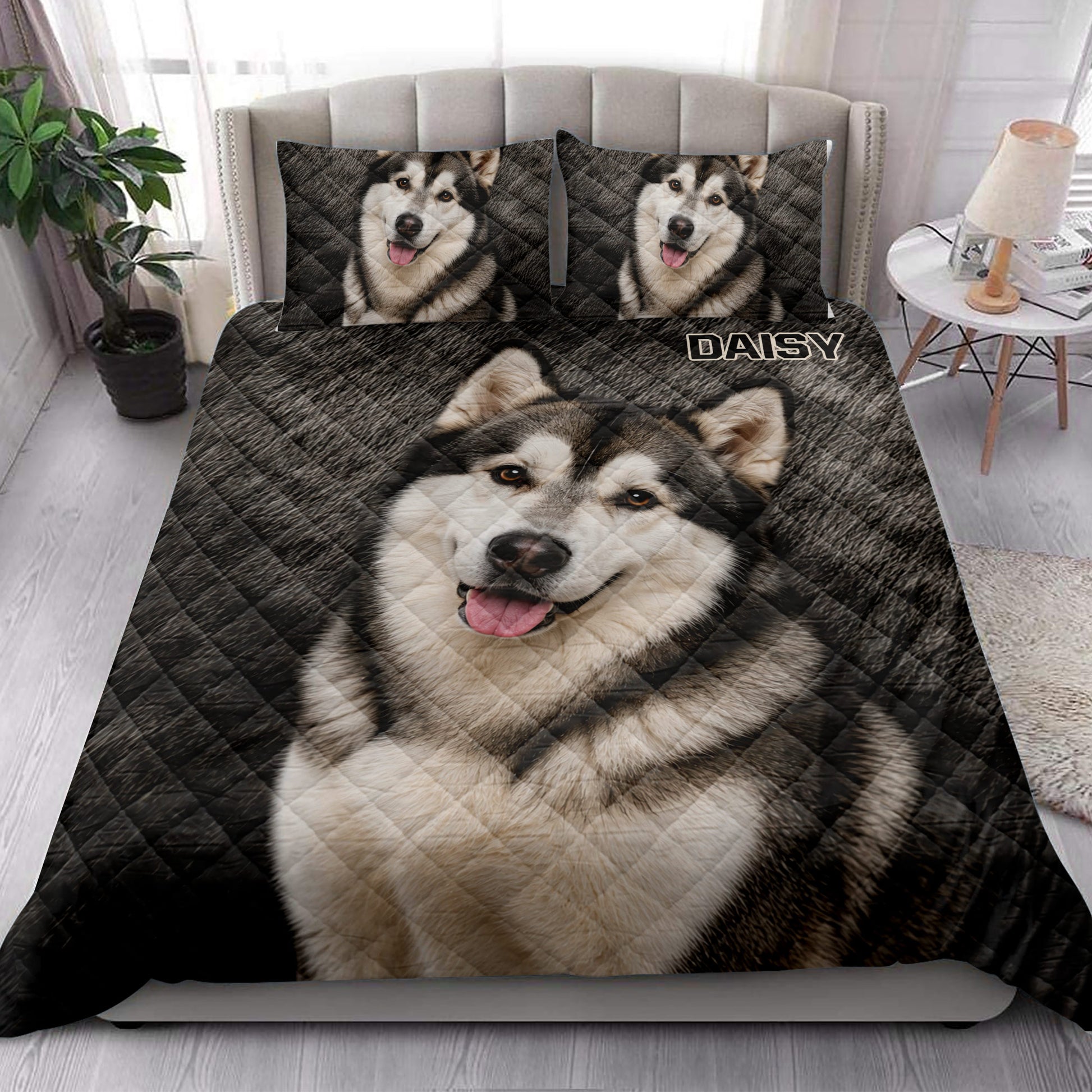 Alaskan Malamute quilt bedding styled in a bright bedroom with a large dog portrait