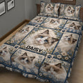 Close bedroom view of a Ragdoll cat quilt blanket with blue-eyed cats, flowers, and paw prints