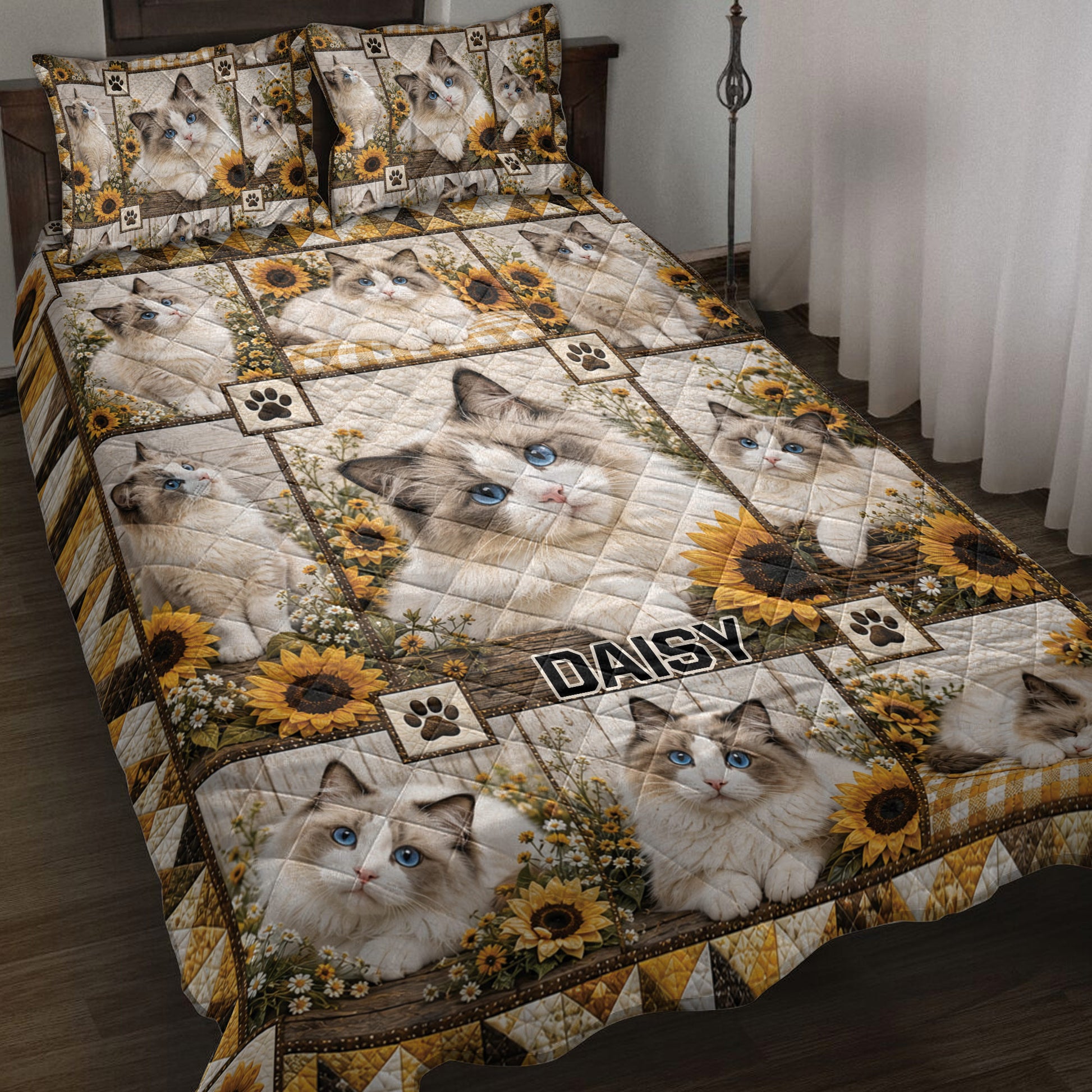Ragdoll cat quilt blanket displayed on a bed with sunflowers, paw prints, and rustic patchwork artwork