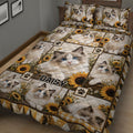 Close bedroom view of a Ragdoll cat quilt blanket with blue-eyed cats, paw prints, and sunflowers