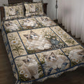 Ragdoll cat quilt blanket featuring blue-eyed cats, daisies, floral panels, and a cozy bedroom setting