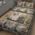 Close bedroom view of a Ragdoll cat quilt blanket with daisy bouquets and detailed blue-eyed cat artwork