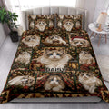 Ragdoll cat Christmas quilt blanket styled on a bed in a bright bedroom with coordinating cat pillows