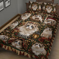 Festive Ragdoll cat quilt blanket displayed on a bed with blue-eyed cats, ornaments, gifts, and lanterns