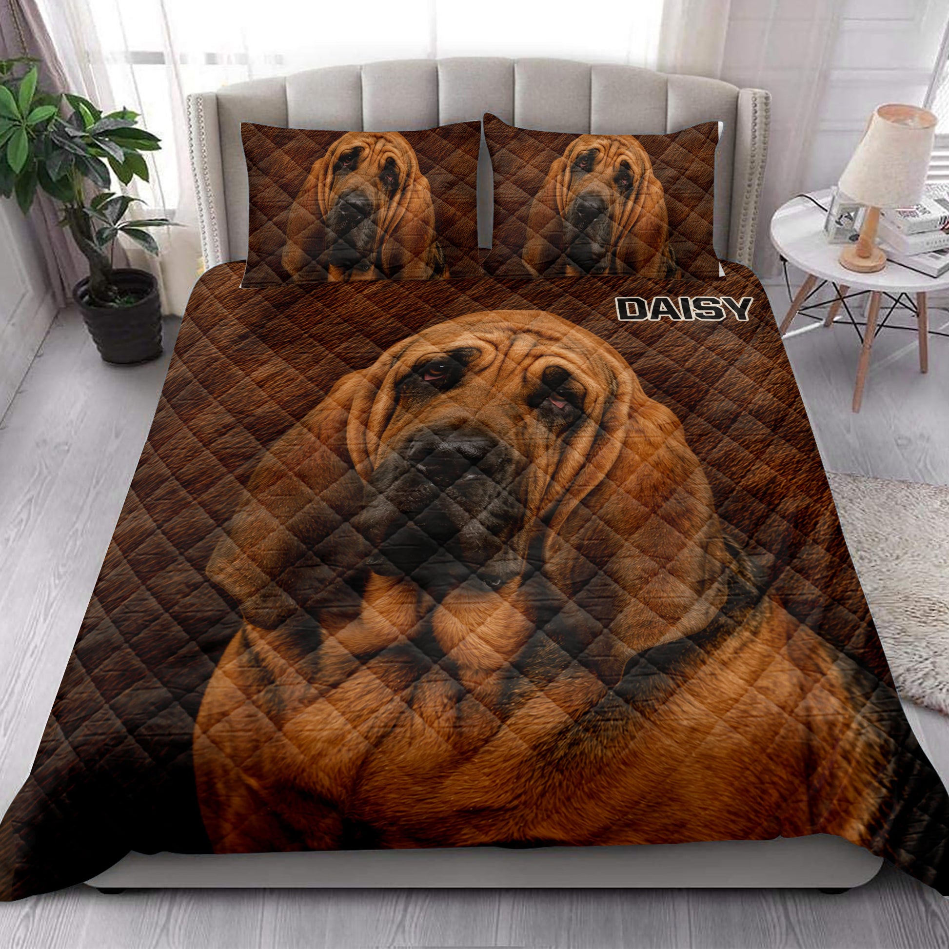 Bloodhound quilt bedding styled in a bright bedroom with large dog portrait artwork