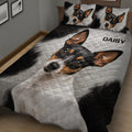 Close bedroom view of a Rat Terrier quilt blanket with bold black, white, and tan artwork
