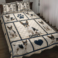 Rat Terrier quilt blanket displayed on a bed with repeated dog portraits, paw prints, hearts, and navy borders