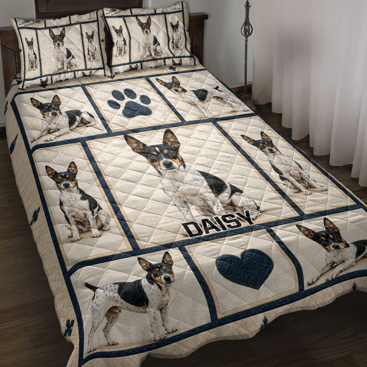 Rat Terrier quilt blanket displayed on a bed with repeated dog portraits, paw prints, hearts, and navy borders