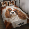 Cavalier King Charles Spaniel quilt blanket styled on a bed with matching dog artwork and pillow designs