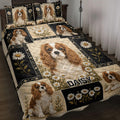 Cavalier King Charles Spaniel quilt blanket displayed on a bed with daisies and black floral panels