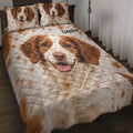 Brittany Spaniel quilt blanket displayed on a bed with matching dog portrait bedding accents