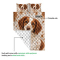 Brittany Spaniel quilt showing the printed front artwork and white quilted backing