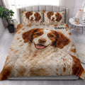 Brittany Spaniel quilt blanket styled in a bright bedroom with dog portrait artwork