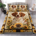 Brittany Spaniel quilt blanket styled in a bright bedroom with sunflower artwork and rustic patchwork